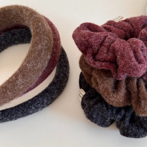 Warm plush fabric scrunchies and wide headband set in earth tones for autumn hairstyle