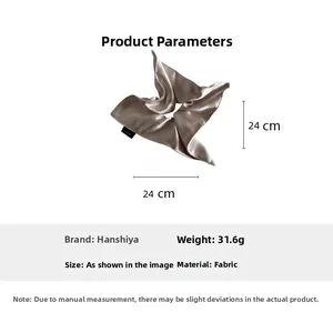 Detailed view of champagne gold satin hair scrunchie with 24cm size specifications