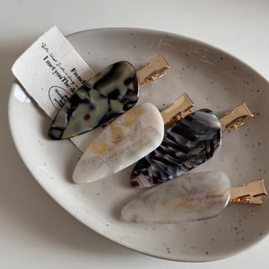 Detailed set of four tortoiseshell acetate hair clips with France Handmade engraving