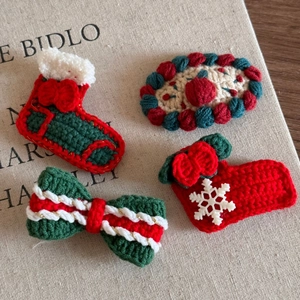 Handmade crochet Christmas hair clips set featuring festive reindeer and stocking designs