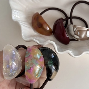 Elegant tortoiseshell acetate hair ties set in crescent shapes with high elasticity bands