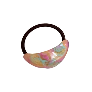 Elastic leopard print hair tie with shimmering pink and mint acrylic crescent charm