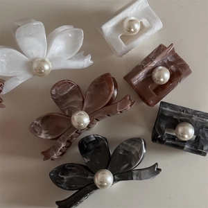 Elegant floral and marble pattern hair clips with premium pearls in multiple colors