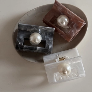 Elegant marble texture hair claws with large pearl accents in amber, grey, and white