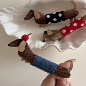 Cute dachshund hair clips set with colorful patterned fabric outfits on white tray