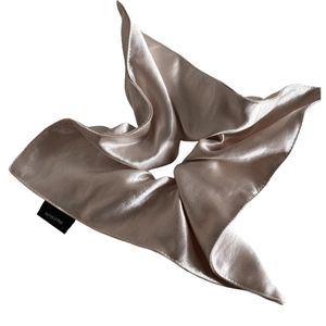 Champagne satin silk scrunchie with handmade tag and elegant glossy texture finish