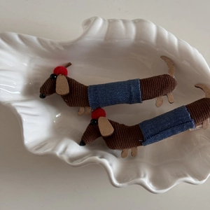 Detail of cute dachshund dog hair clips featuring brown corduroy and blue denim fabric