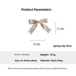 Detailed dimensions of beige fabric bow hair clip showing 15x12cm size and 10cm spring clip