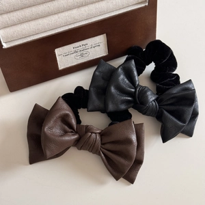 Elegant faux leather double-layered bow hair ties in dark brown and black colors