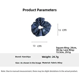 Detail view of denim blue plaid scrunchie showing 13cm diameter size and button accent