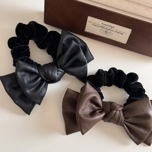 Faux leather double bow hair scrunchie set in black and brown with velvet texture