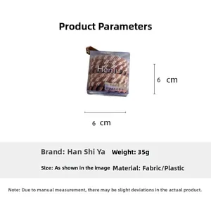 Detail view of 35g elastic hair ties set in 6x6cm clear box with size measurements