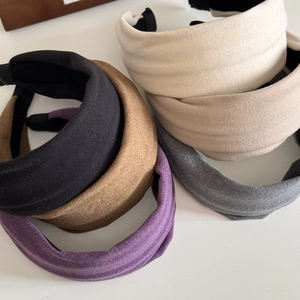 Padded solid color fabric headbands in assorted colors with thick soft sponge texture