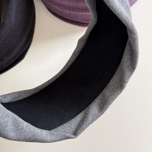 Close-up of thick grey velvet headband showing soft texture and black non-slip lining