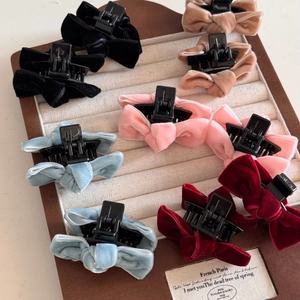 Mini velvet bow hair claws for women in five colors with a minimalist French style design