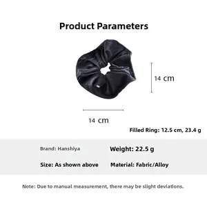Detail of black velvet scrunchie showing 14cm diameter and 22.5g weight specs