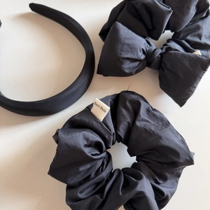 Three-piece set of black handmade hair accessories including bow scrunchie and headband