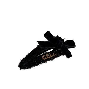 Elegant black tweed hair clip with velvet bow and golden metal letter detail