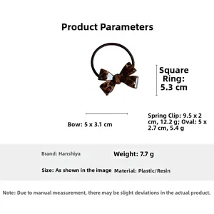 Detailed view of leopard print hair tie with dimensions 5x3.1cm bow and 5.3cm ring