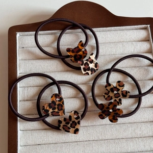 Set of leopard print acrylic hair ties with cat, heart and floral shapes and sparkles