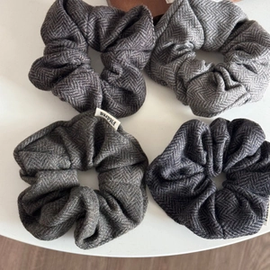 Set of four wool herringbone scrunchies in elegant grey and black shades for autumn style