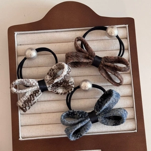 Three elegant tweed bow hair ties with pearls in brown, taupe and blue vintage colors