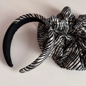Close-up of zebra pattern headband and large scrunchie set with metallic luster finish
