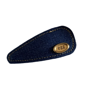Denim blue oval BB hair clip with gold metal tag and yellow stitching for women