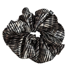 Satin zebra striped scrunchie with black and white patterns and a number 5 tag