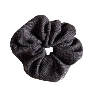 Grey herringbone wool hair scrunchie shown on a white background in a centered view