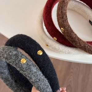 Plush wool headband with gold oval buckle engraved with Believe In Yourself text