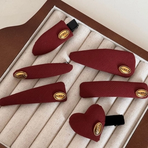 Elegant 6-piece wine red fabric hair clip set with gold metal labels for women