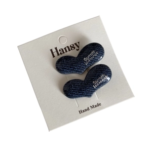 Set of two denim blue heart hair clips with woven texture and silver letter accents