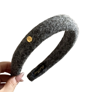 Gray sherpa fleece headband with a gold engraved metal buckle for women's winter style