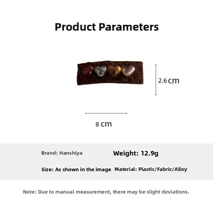 Close-up of brown plush heart hair clip with size 8cm x 2.6cm and material specs
