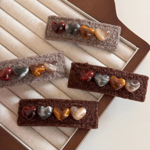 Plush faux fur heart hair clips in brown and oat tones for autumn winter hair styling