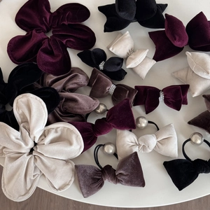 Elegant velvet hair accessories set featuring bow clips and scrunchies in deep colors