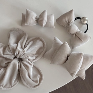 Detailed set of light gray velvet hair accessories with pearls and metallic ball charms