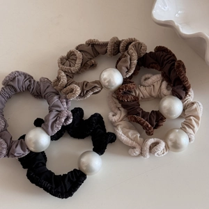 Elegant ruffled pearl hair scrunchies in four neutral colors with soft plush edges