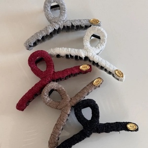 Elegant tweed fabric hair claws set in five colors with golden oval egg emblem