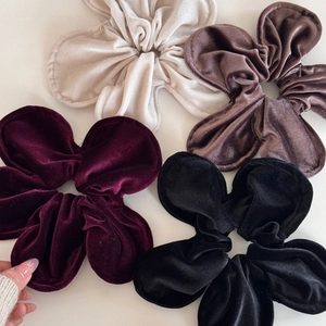 Close-up of velvet petal hair ties in cream white, gray coffee, wine red and black