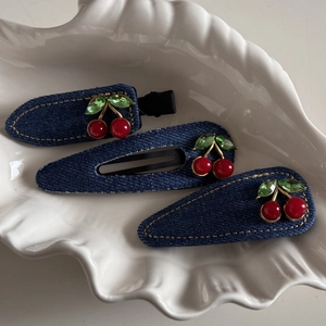 Three-piece set of dark blue denim hair clips with red cherry rhinestones and yellow stitching