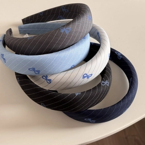 Set of 5 striped hairbands with blue bow patterns in navy, grey, blue, and white colors