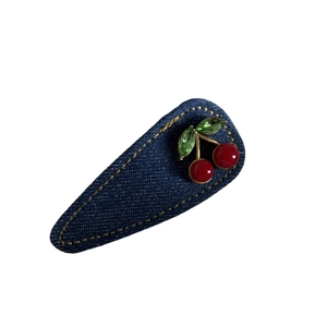 Dark blue denim hair clip with red cherry rhinestones and yellow stitching details