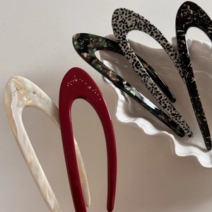 Set of five elegant U-shaped acetate hair forks with diamond accents in various textures