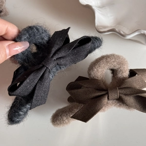 Elegant plush fabric bow hair claw clips in dark grey and brown for stylish updos