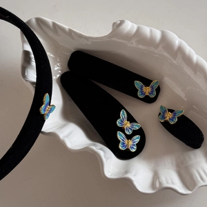 Detailed set of black velvet hair accessories with blue butterfly enamel ornaments