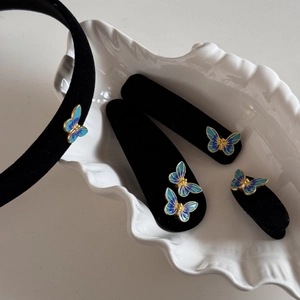 Vintage blue butterfly velvet headband and hairpin set with gold edges on white background