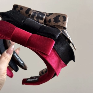 Three-piece velvet headband set in leopard print, black and burgundy with hand made label