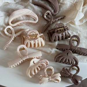 Elegant marble pattern bow and geometric hair claws in creamy white and chocolate brown colors